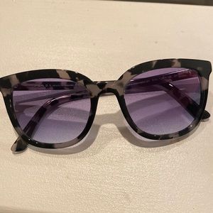 Prada sunglasses with original packaging and box.